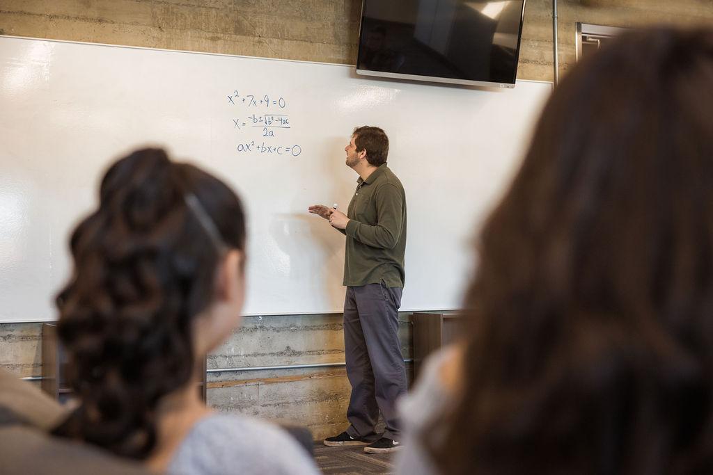 Lydian Academy teacher working on a problem